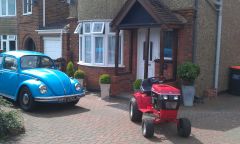Juliette enjoying her new driveway and garage next to my mums 1972 VW Beetle 1300