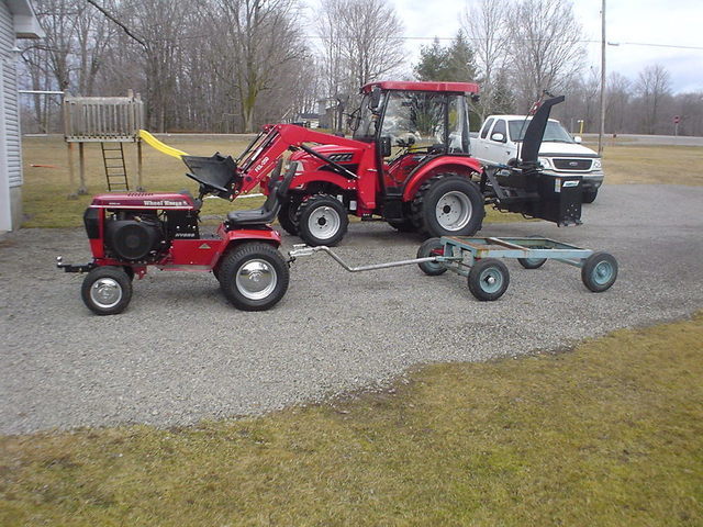 56ed692d55373_Wagonhitchedtotractorlowre