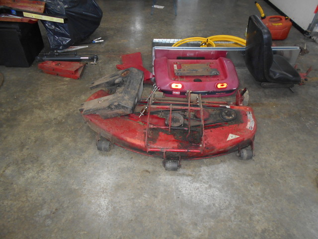 Mower deck and tractor parts.JPG
